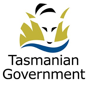 A logo featuring a stylized representation of a face with flowing hair or foliage above it, set against a blue wave at the bottom. Below the graphic, the words "Tasmanian Government" are displayed in bold black font.